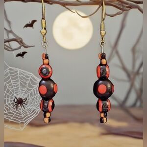 Artisan orange and black beaded earrings
